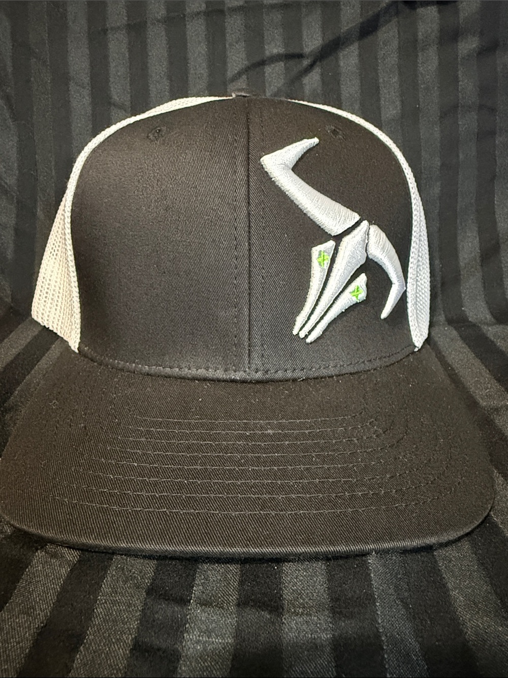 Men's Black and White Trucker Hat with Contrasting Logo